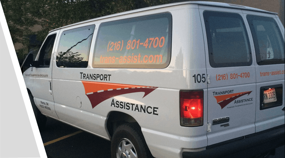 A van with the words " transport assistance ".